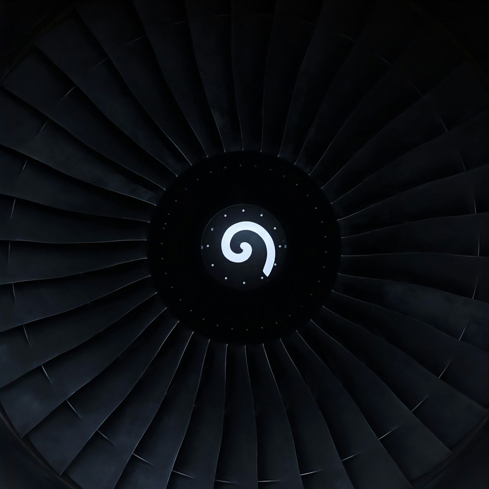 a close up of a jet engine in the dark